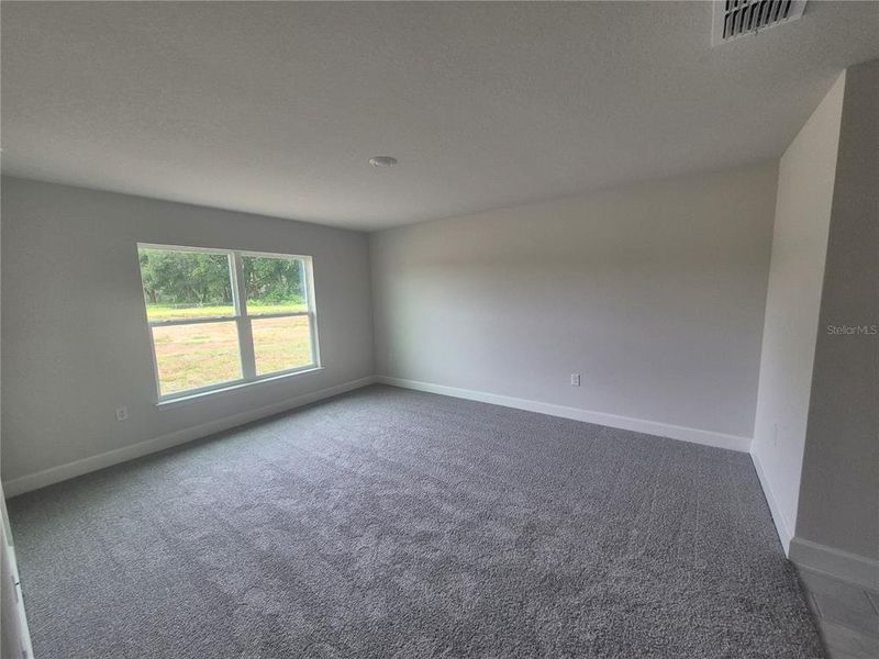 Spacious, unfurnished interior of a new home in Hill Country Estates, Dade City (Image 25).