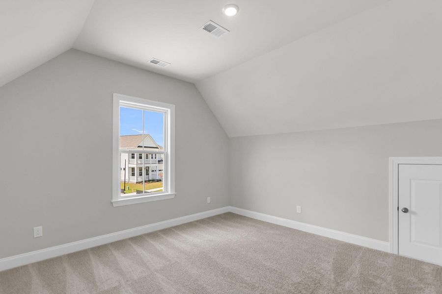 Spacious, unfurnished interior of a new home in Tidewater at Lakes of Cane Bay, Summerville (Image 19).