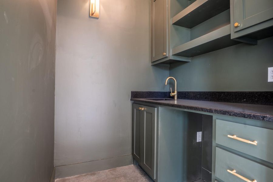 Bar with gray cabinetry and open shelves