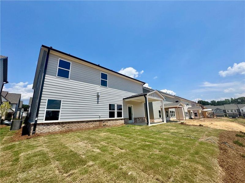 Exterior details and patio area of a home in Eastlyn Crossing, Flowery Branch (Image 4).