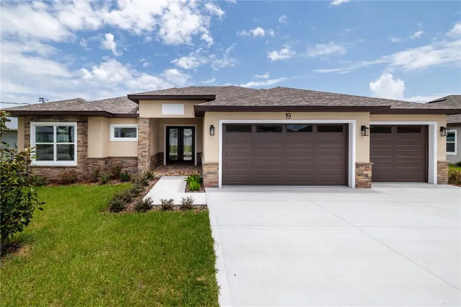 Front exterior of a new home in , Palm Coast, FL, highlighting curb appeal (Image 20). Front exterior of a new home in , Palm Coast, FL, highlighting curb appeal (Image 20).