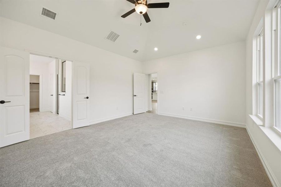 Spacious owner's suite with private bath. Model representation.