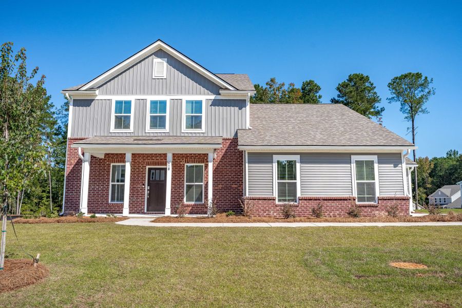 Front exterior of a new home in Oakleaf Chase, Blythewood, SC, highlighting curb appeal (Image 21).