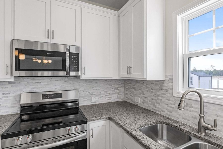 Representative furnished interior of a home built from the Magnolia by Caviness & Cates Communities in Bartlett Manor, Youngsville (Image 207).