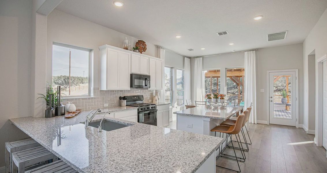 Representative furnished interior of a home built from the Lyndon by Chesmar Homes in Meyer Ranch, New Braunfels (Image 7).