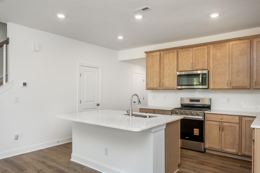 Furnished interior view inside a new home in Running Brook Townes, Durham (Image 7).