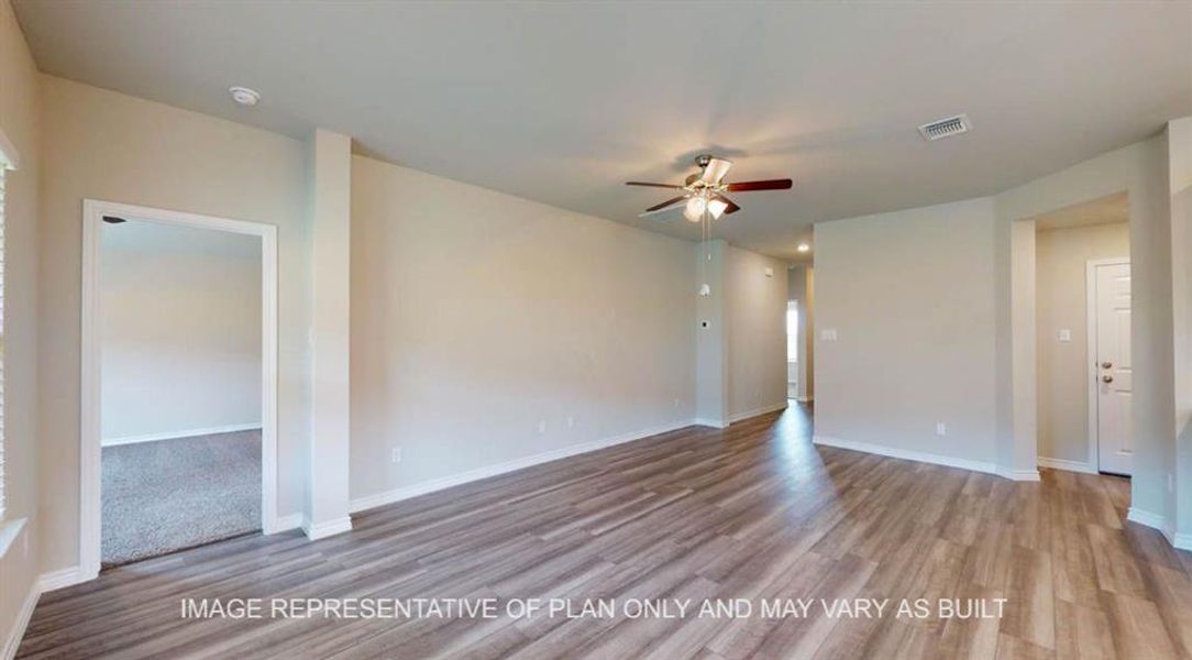 Empty room featuring light wood-style flooring and ceiling fan Empty room featuring light wood-style flooring and ceiling fan