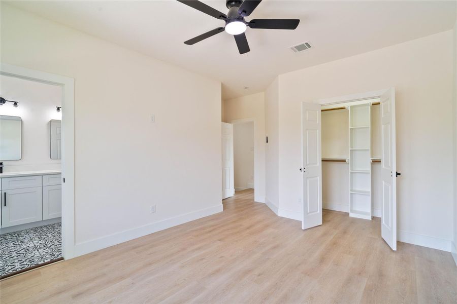 All bedrooms feature upgraded flooring and ceiling fans