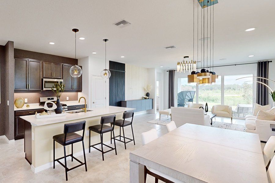 Representative furnished interior of a home built from the Tiller by Homes by Towne in Shellstone at Waterside, Sarasota (Image 7).