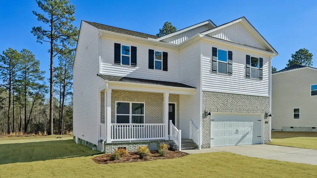 Front exterior of a new home in Gretchen Pines, West End, NC, highlighting curb appeal (Image 2).