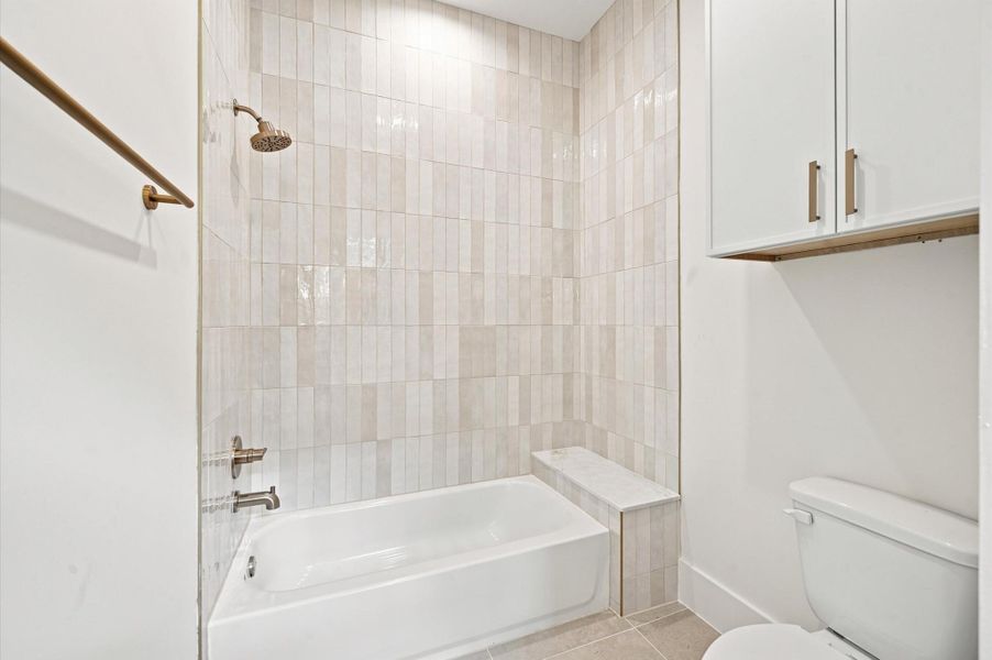 Secondary bath with tub/shower combination.