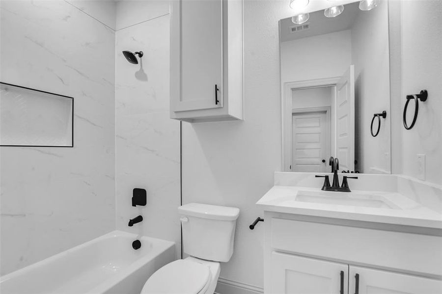 Full bath featuring vanity and shower / bath combination Full bath featuring vanity and shower / bath combination