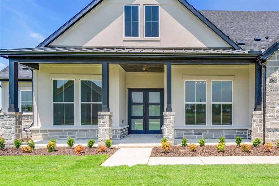 View of front of house with a front lawn and a porch