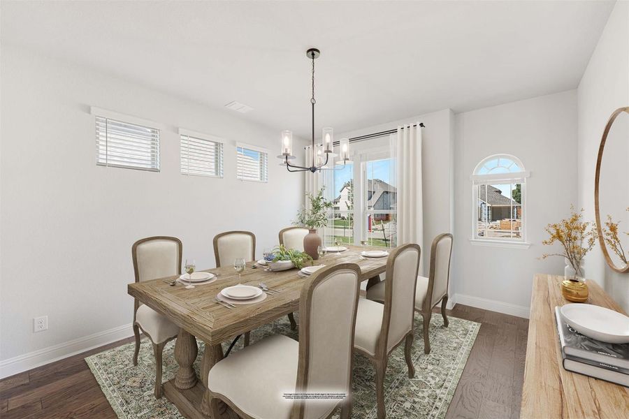 Dining room with wood table, six upholstered chairs, chandelier, and dark hardwood floors