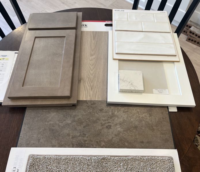 Atlanta Shaker cabinets in White will be in the kitchen and the island and bathrooms will have the Shaker cabinets in "Drift". Pain is Grey/beige, quartz, Laminate in high traffic areas, LVT in full baths and laundry, Carpet in bedrooms. Backsplash!