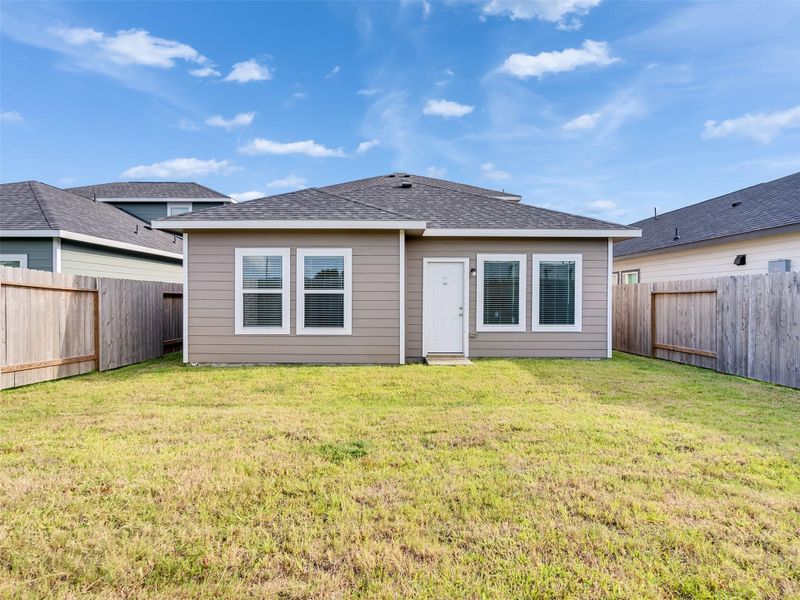 Exterior details and patio area of a home in Sweetgrass Village, Barrett (Image 2).