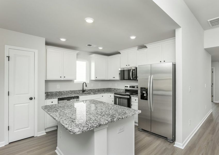 The kitchen overlooks the living area