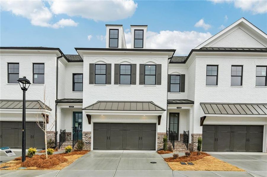Front exterior of a new home in Millcroft Townhomes, Buford, GA, highlighting curb appeal (Image 22). Front exterior of a new home in Millcroft Townhomes, Buford, GA, highlighting curb appeal (Image 22).
