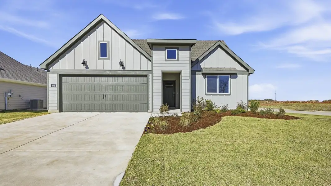 Front exterior of a new home in Windrose, Pilot Point, TX, highlighting curb appeal (Image 1). Front exterior of a new home in Windrose, Pilot Point, TX, highlighting curb appeal (Image 1).