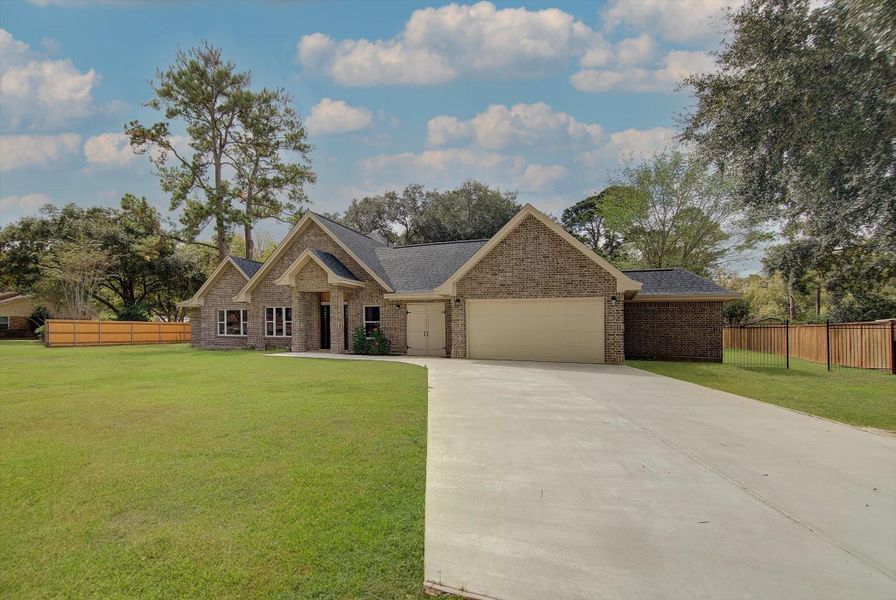 Front exterior of a new home in , Dayton, TX, highlighting curb appeal (Image 2). Front exterior of a new home in , Dayton, TX, highlighting curb appeal (Image 2).