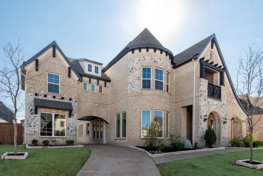 Front exterior of a new home in South Pointe, Mansfield, TX, highlighting curb appeal (Image 2).