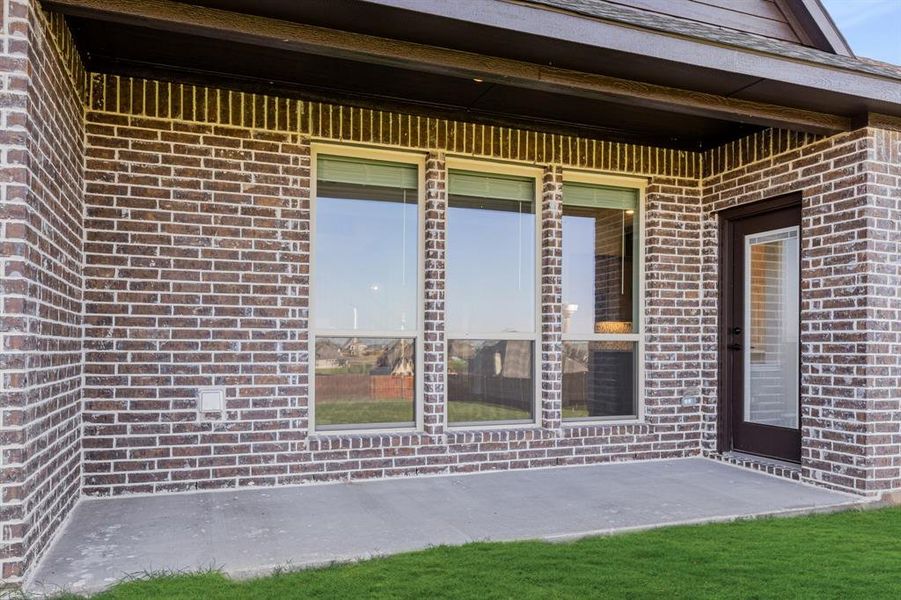 Exterior details and patio area of a home in Coyote Crossing, Godley (Image 4).