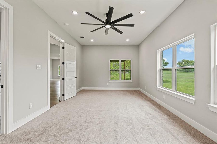Bedroom featuring recessed lighting and a ceiling fan