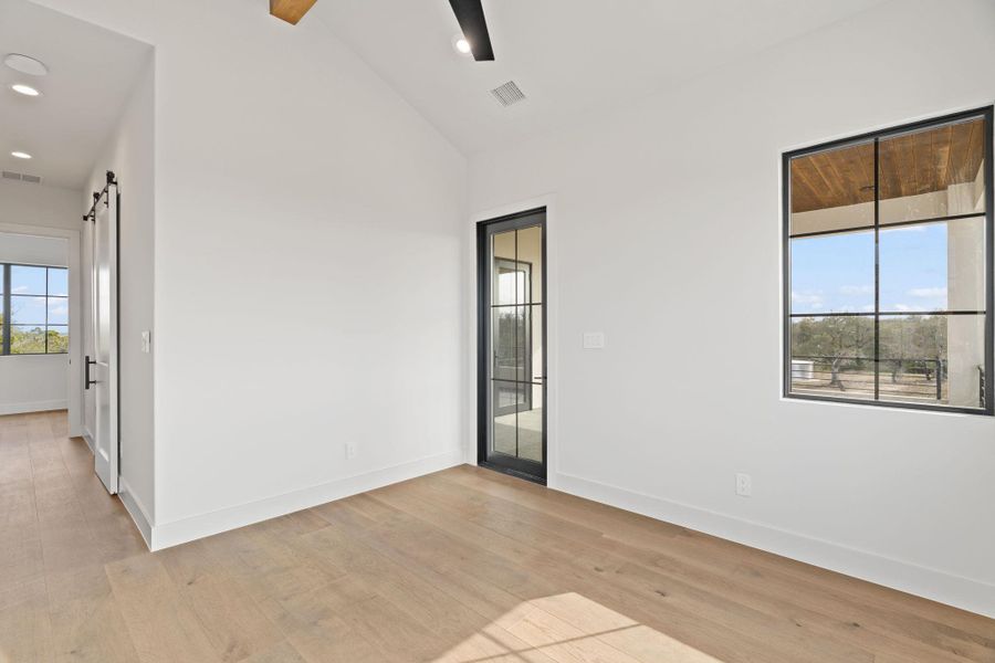 3 of 3 bedroom upstairs with glass French door leading to balcony with ensuite bath.