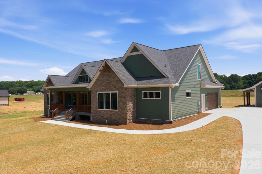 Front exterior of a new home in , Statesville, NC, highlighting curb appeal (Image 1). Front exterior of a new home in , Statesville, NC, highlighting curb appeal (Image 1).
