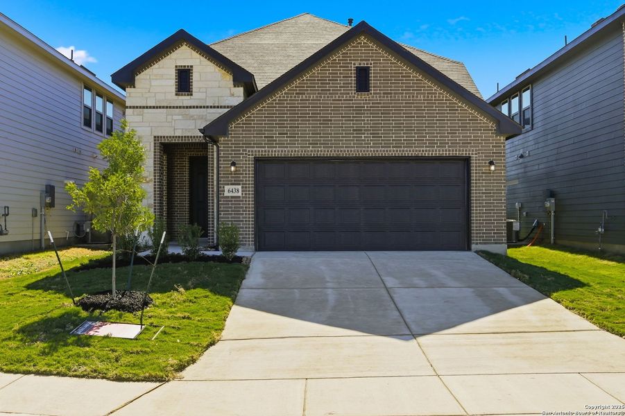 Front exterior of a new home in Morgan Meadows, San Antonio, TX, highlighting curb appeal (Image 1). Front exterior of a new home in Morgan Meadows, San Antonio, TX, highlighting curb appeal (Image 1).
