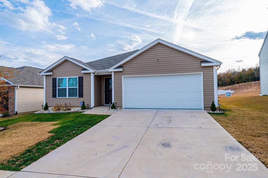 Front exterior of a new home in Villages of Maiden, Maiden, NC, highlighting curb appeal (Image 2). Front exterior of a new home in Villages of Maiden, Maiden, NC, highlighting curb appeal (Image 2).