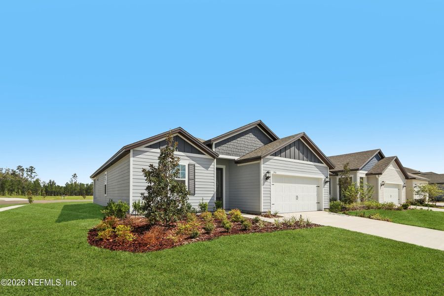 Front exterior of a new home in Westport Landing, Jacksonville, FL, highlighting curb appeal (Image 18).