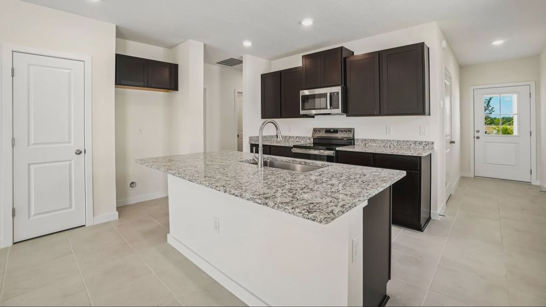 Furnished interior view inside a new home in Willowbrook North, Winter Haven (Image 13).