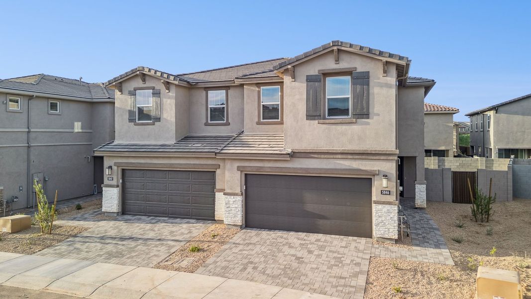 Front exterior of a new home in Talinn Towns at Desert Ridge, Phoenix, AZ, highlighting curb appeal (Image 17).