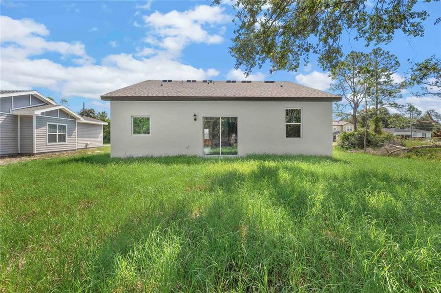 Front exterior of a new home in Poinciana, Poinciana, FL, highlighting curb appeal (Image 2).