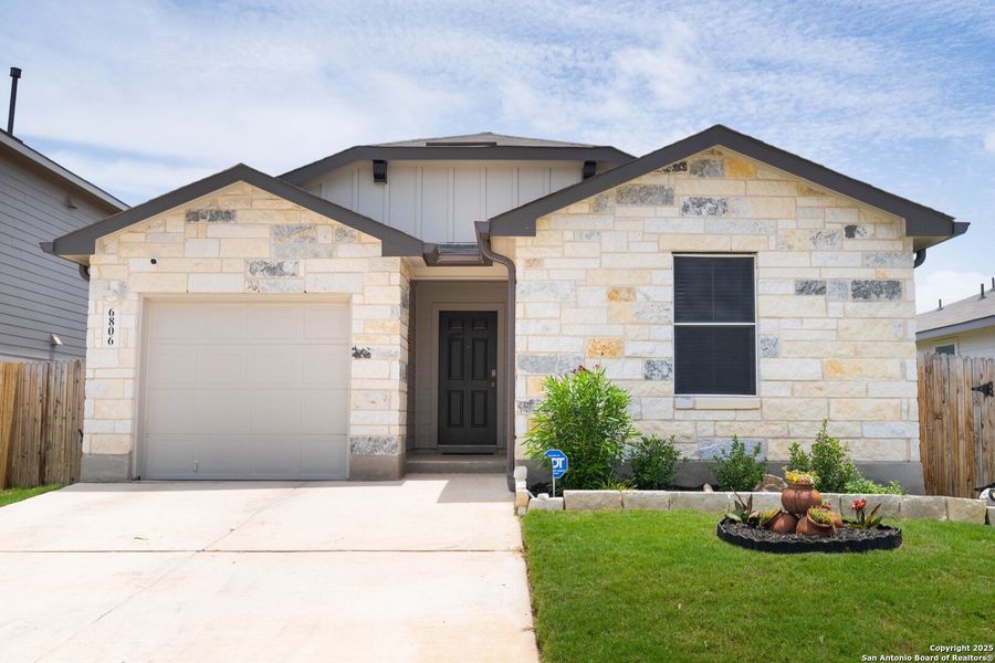 Front exterior of a new home in Whisper Falls, San Antonio, TX, highlighting curb appeal (Image 21). Front exterior of a new home in Whisper Falls, San Antonio, TX, highlighting curb appeal (Image 21).