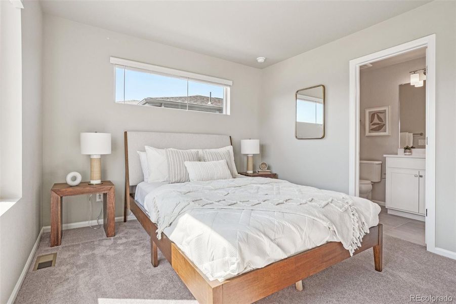 Furnished interior view inside a new home in Woodrose at Painted Prairie, Aurora (Image 12).