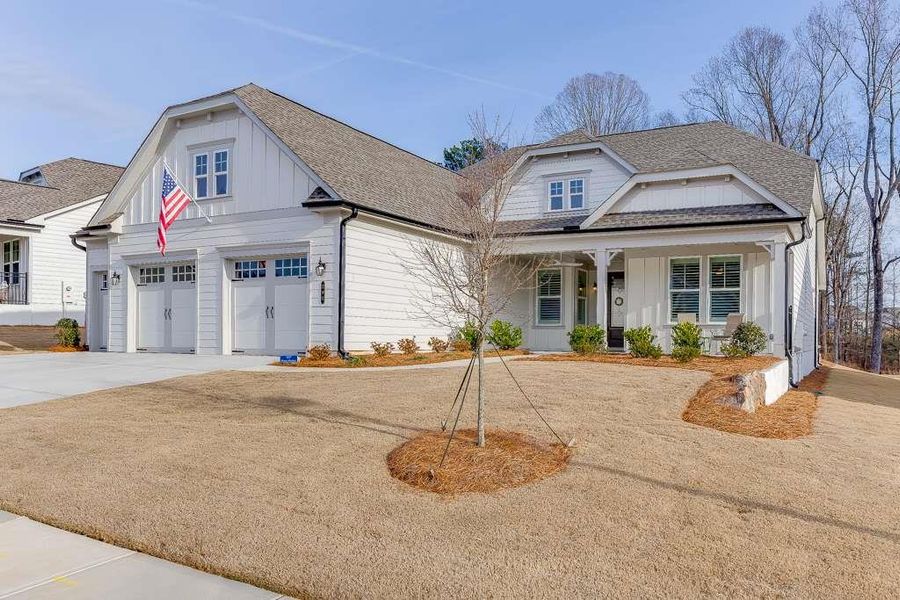 Front exterior of a new home in , Hoschton, GA, highlighting curb appeal (Image 21).
