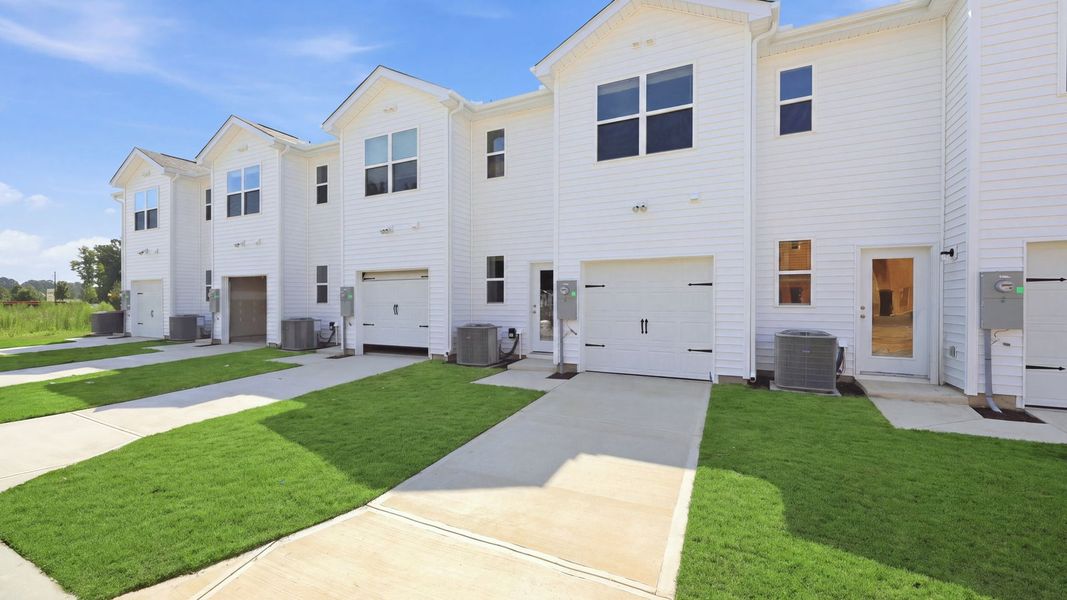 Front exterior of a new home in Clock Road Townhomes, New Bern, NC, highlighting curb appeal (Image 23).