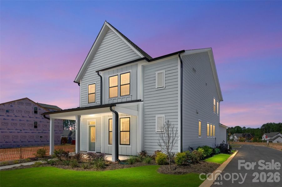 Front exterior of a new home in The River District - Pioneer Collection, Charlotte, NC, highlighting curb appeal (Image 16).