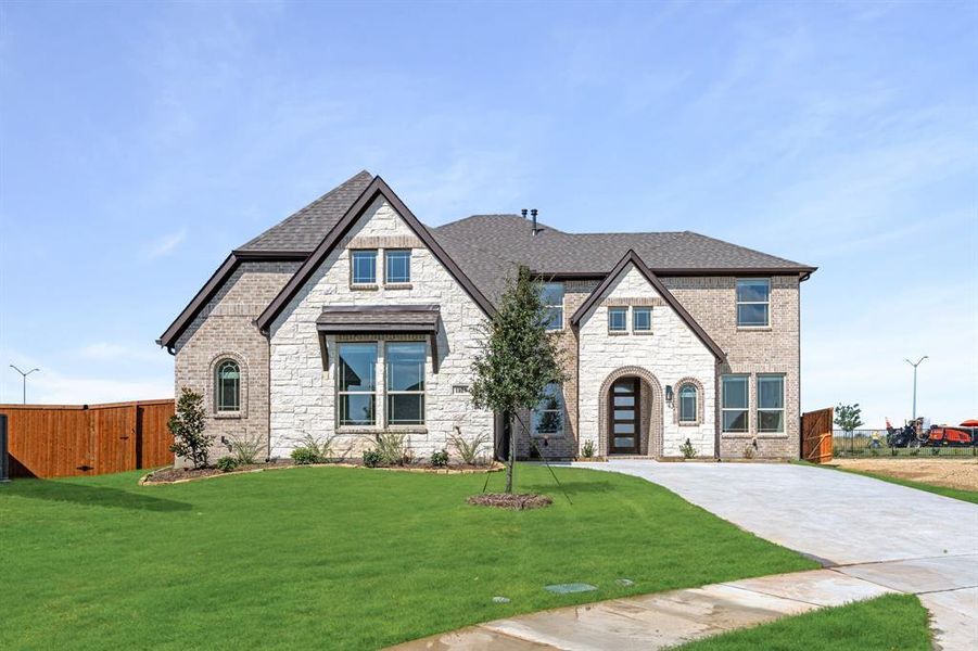 Front exterior of a new home in Timberbrook 3B-4A, Justin, TX, highlighting curb appeal (Image 2).