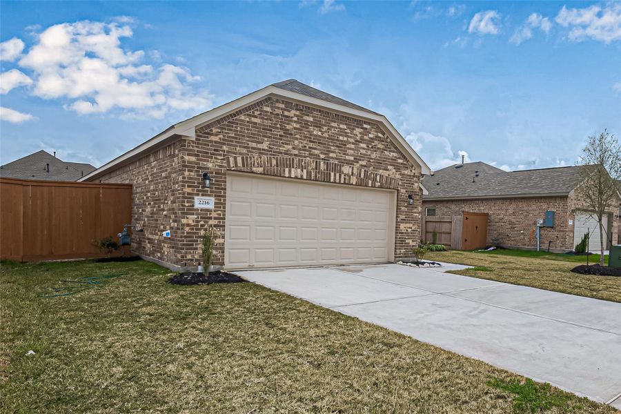 Front exterior of a new home in Lago Mar, Texas City, TX, highlighting curb appeal (Image 1).