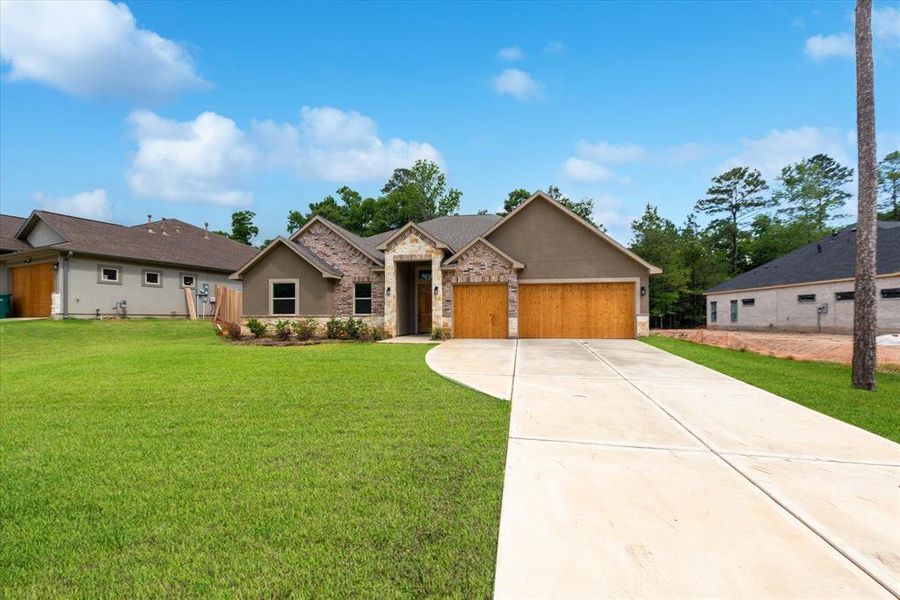 Large front yard with long driveway. What a beauty