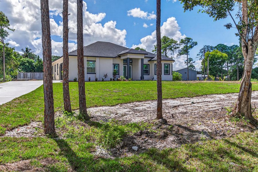 Exterior details and patio area of a home in , The Acreage (Image 35). Exterior details and patio area of a home in , The Acreage (Image 35).