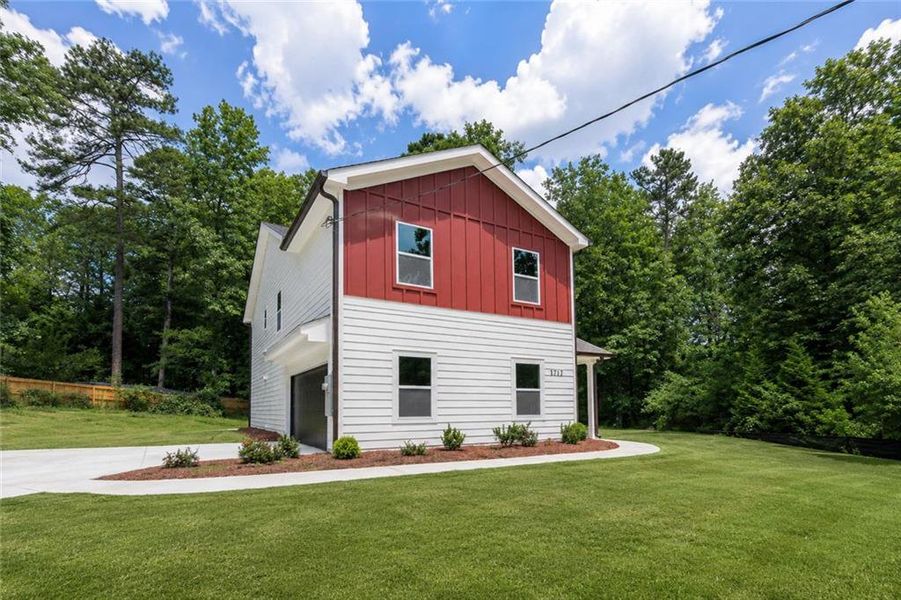 Front exterior of a new home in , Lithonia, GA, highlighting curb appeal (Image 19).