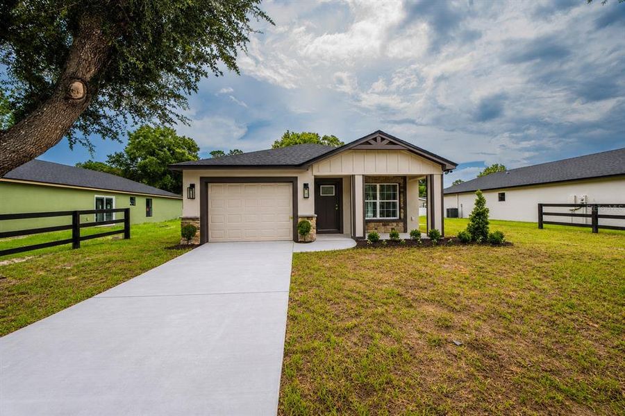 Front exterior of a new home in , Lakeland, FL, highlighting curb appeal (Image 1). Front exterior of a new home in , Lakeland, FL, highlighting curb appeal (Image 1).