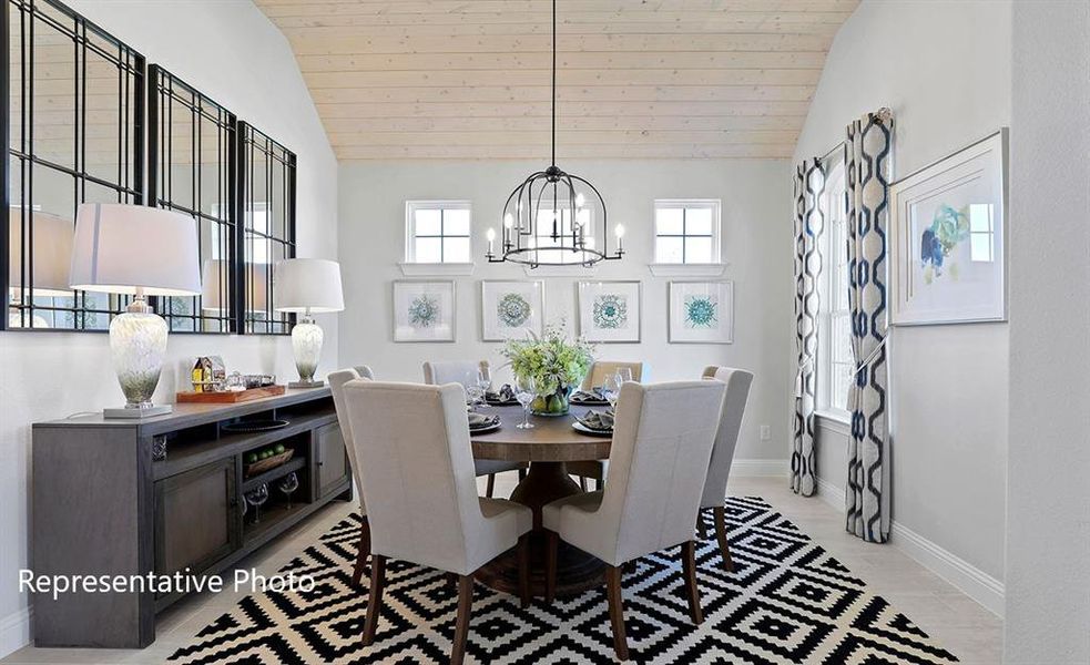 Dining room featuring a chandelier, high vaulted ceiling, and wooden ceiling