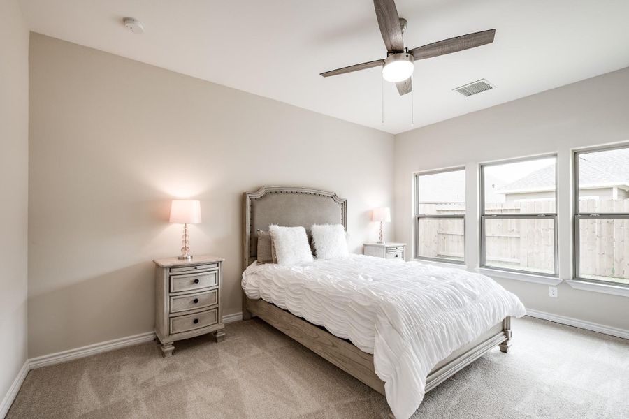 Large primary suite with soft natural light. Large primary suite with soft natural light.