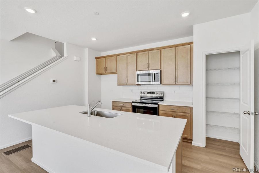 Furnished interior view inside a new home in Turnberry Villas, Commerce City (Image 14).
