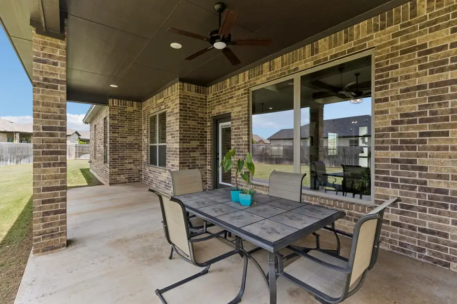 Designed as an extension of the home itself, this spacious covered patio invites everything from quiet mornings to relaxed evenings with friends.